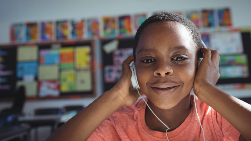 close up of boy in the classroom wearing headphones