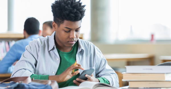 teen on cellphone in the classroom