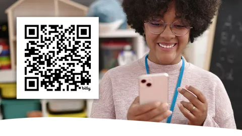 Photo of a teacher following the Common Sense Education Instagram account and smiling