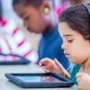 kids listening to podcasts in the classroom